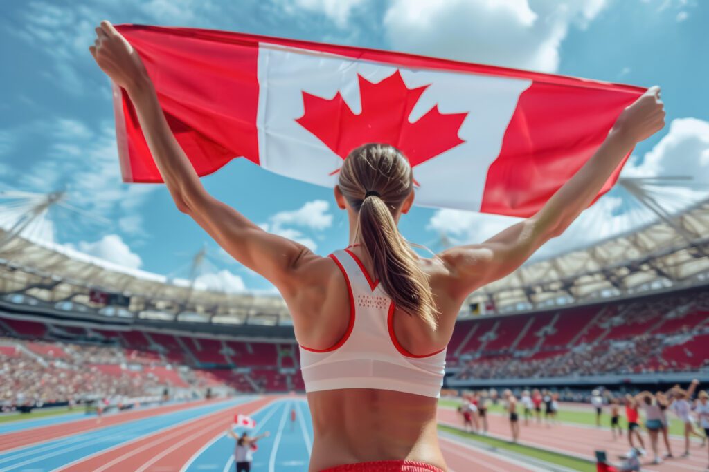 Track athlete with Canadian flag raised