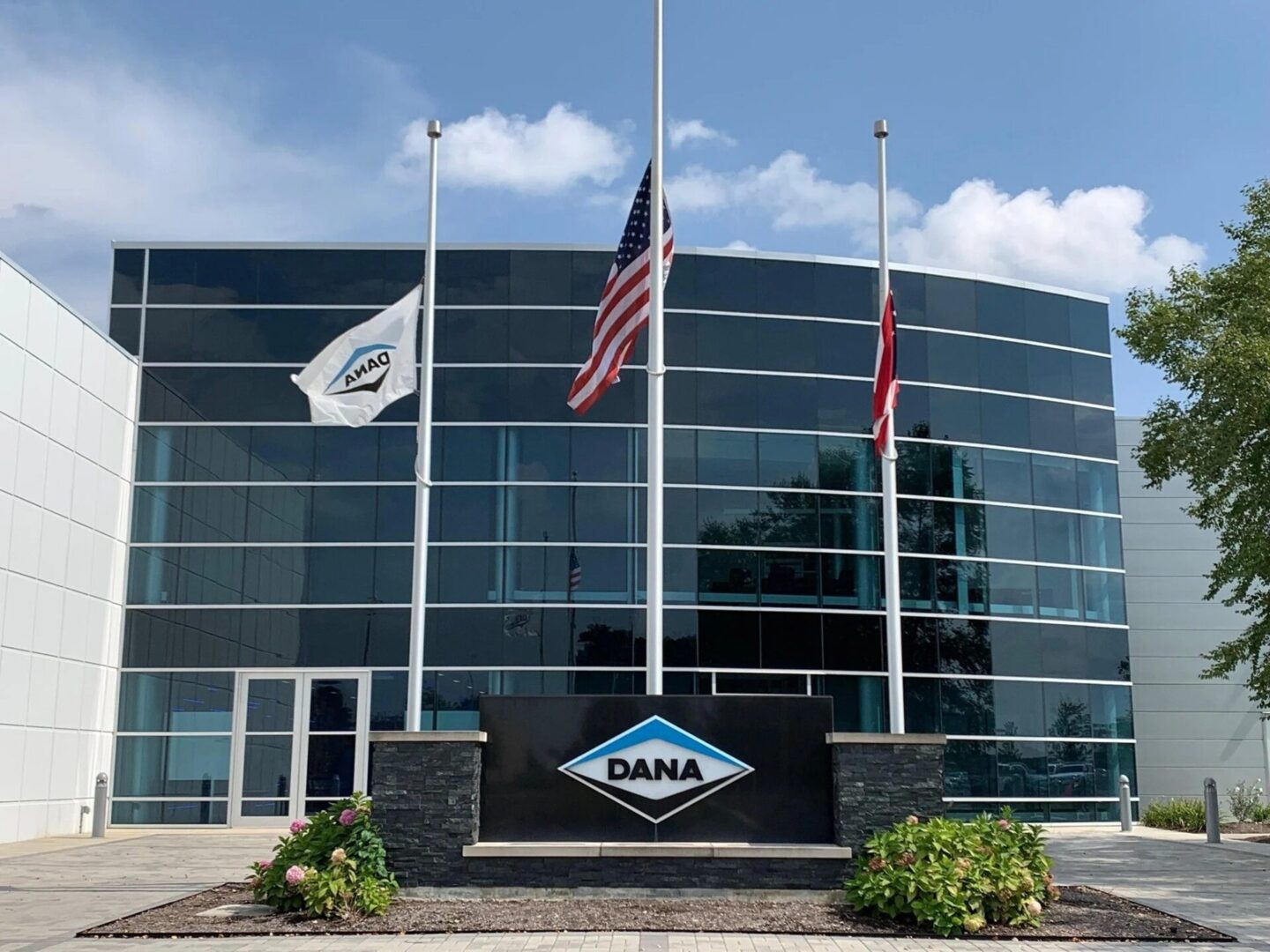 Corporate building with flags and logo