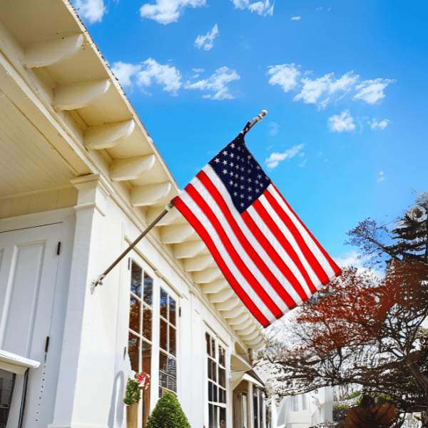 American flag waving outside white house