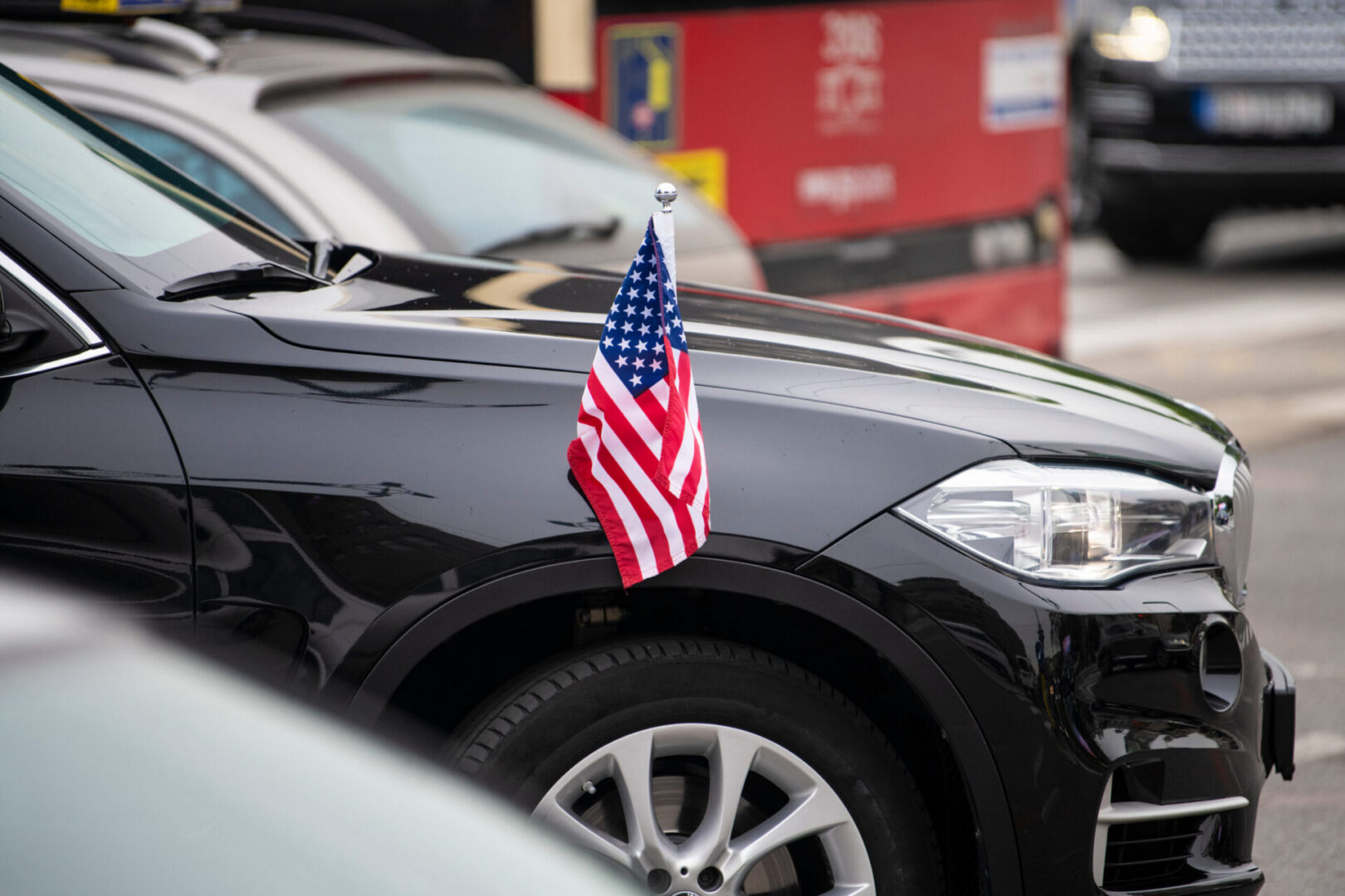 Black car with small American flag